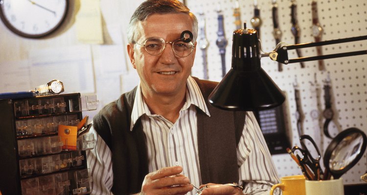 Man repairing wristwatches