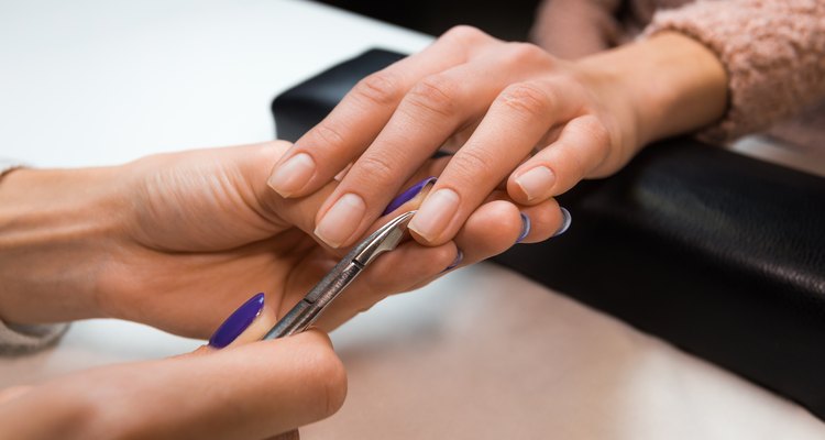 Removing the cuticle by manicure nippers
