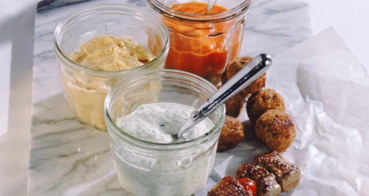 Kebab and meatball with hummus on marble, close-up