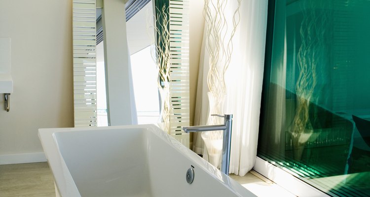 Splashes of green in a pine wood bathroom will carry you to the shores of tropical seas