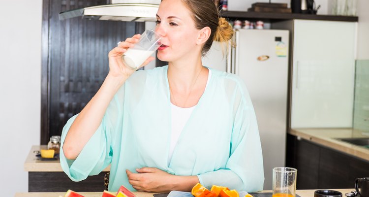 Women drinking milk in the kitchen