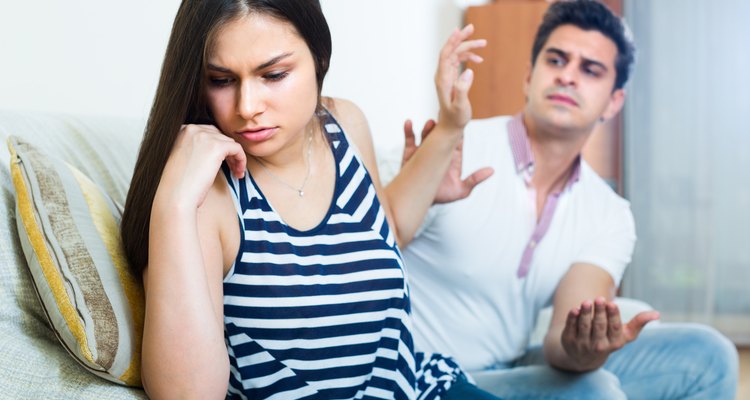 Young couple during indoor quarrel