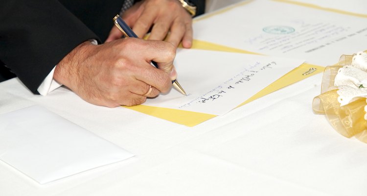 Man Signing a Rites of Matrimony Document