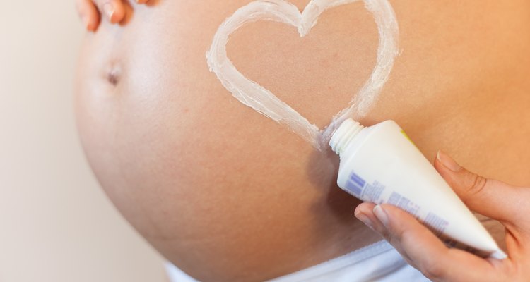 Pregnant woman with a heart symbol on her stomach