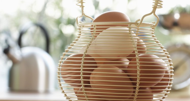 Eggs in wire basket on kitchen counter