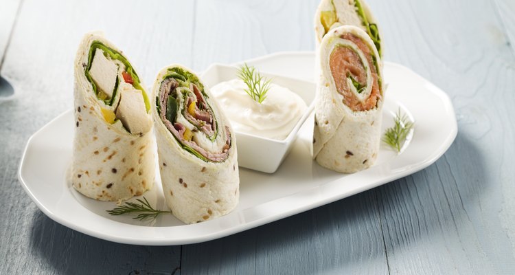 Mix of wraps with ham, chicken, salmon and crab served