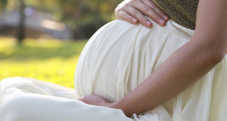 Pregnant woman in a garden