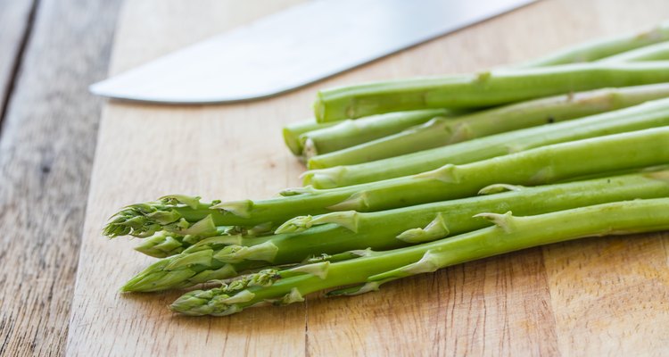 asparagus on wood background.