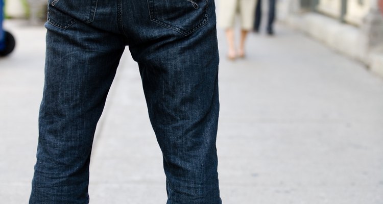 Man standing outdoors on sidewalk