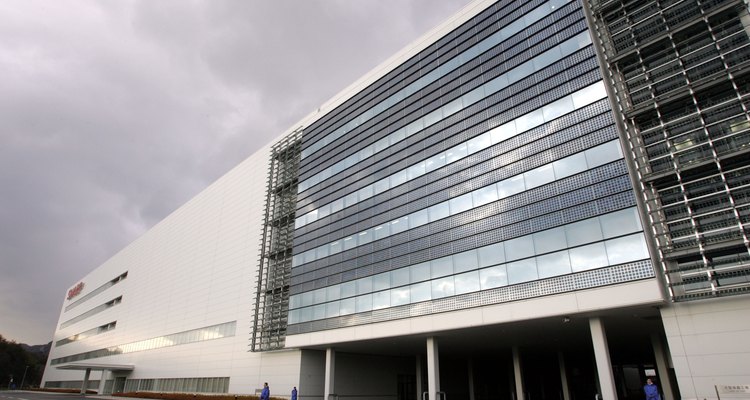 Solar panels on building walls generate electricity for the building.