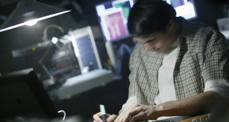 A soldering iron heats electrical components so that solder can be applied.