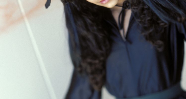Define the eyes by darkening and arching the eyebrows with an eyebrow pencil.