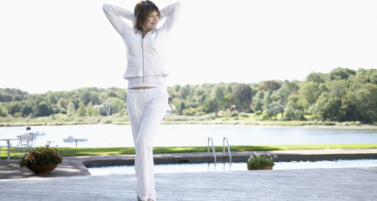 Woman stretching near pool