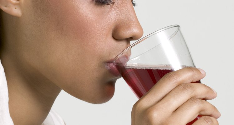 Woman drinking glass of juice
