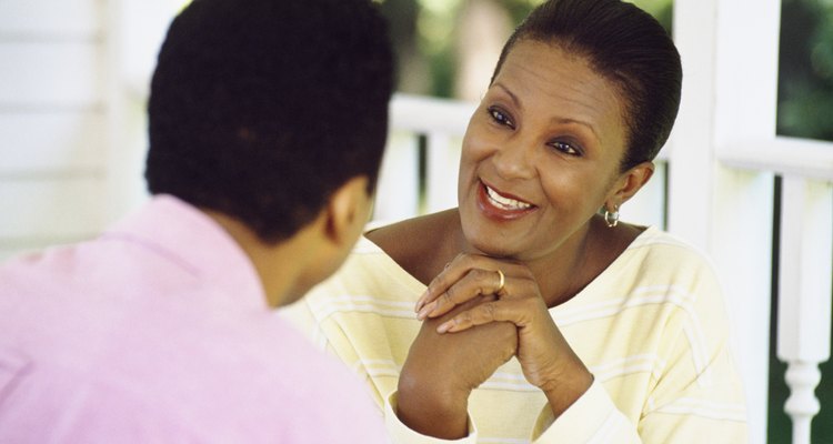 Conversation between couple sitting on porch