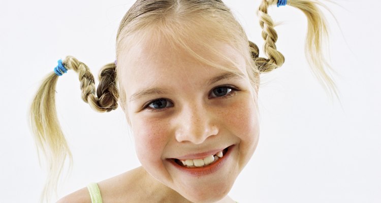 Smiling girl with pigtails