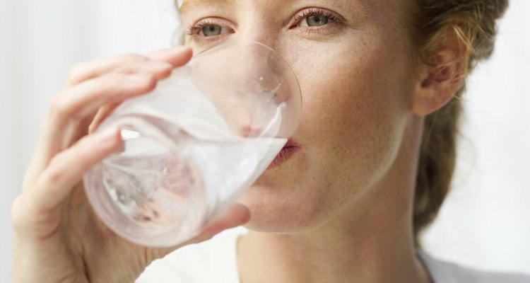 close-up of a woman drinking water from a glass