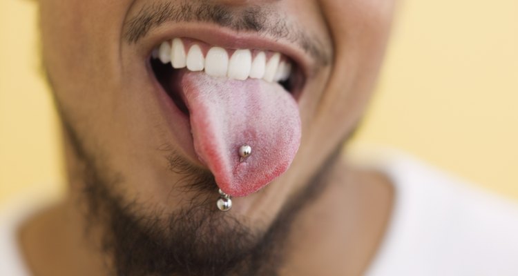 Young man showing off his tongue ring