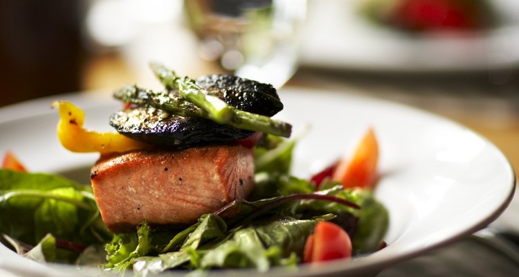 Bowl of salad with salmon and roasted vegetables