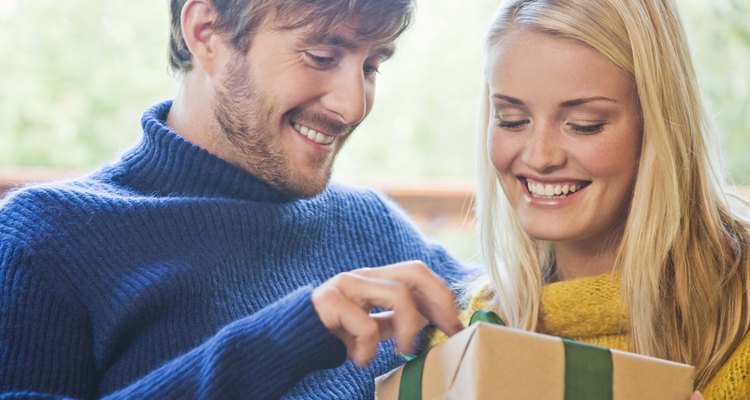 Couple holding wrapped present