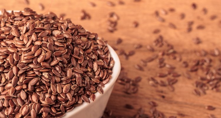 Flax seeds linseed in bowl on wooden table