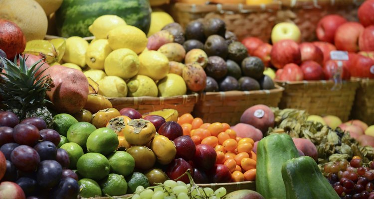 Fruit market with various colorful fresh fruits and vegetables -