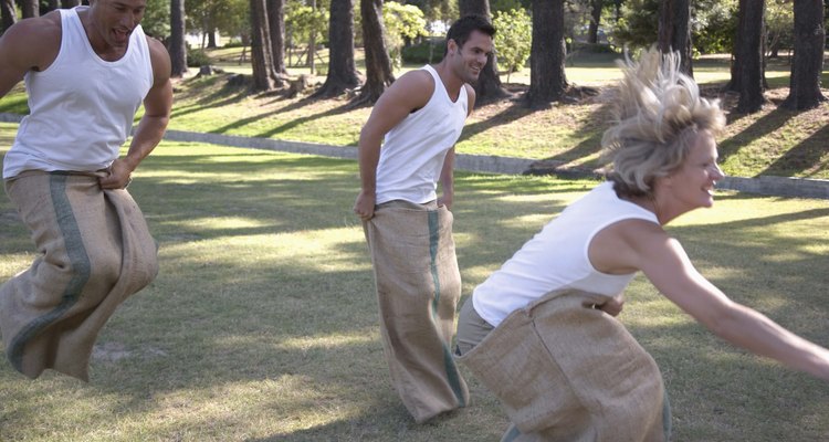 People hopping in sack race