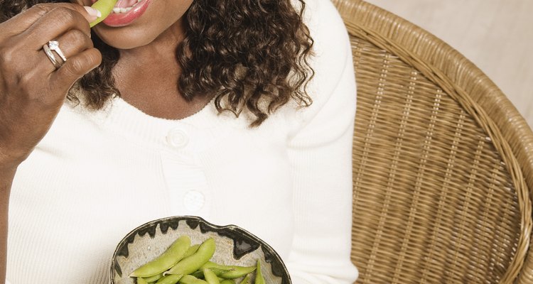 Woman eating edamame