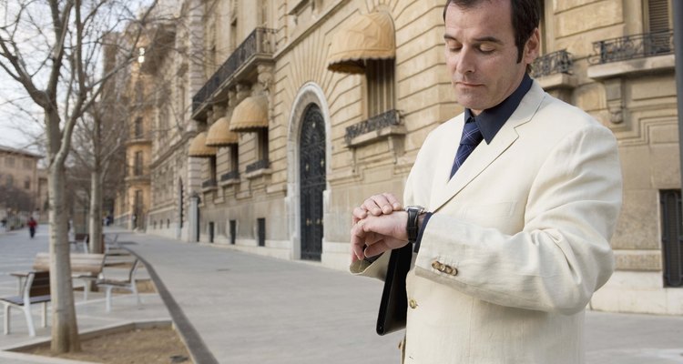 Businessman looking at watch