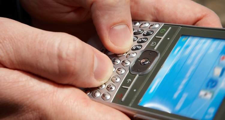 Close-up of person texting on smartphone