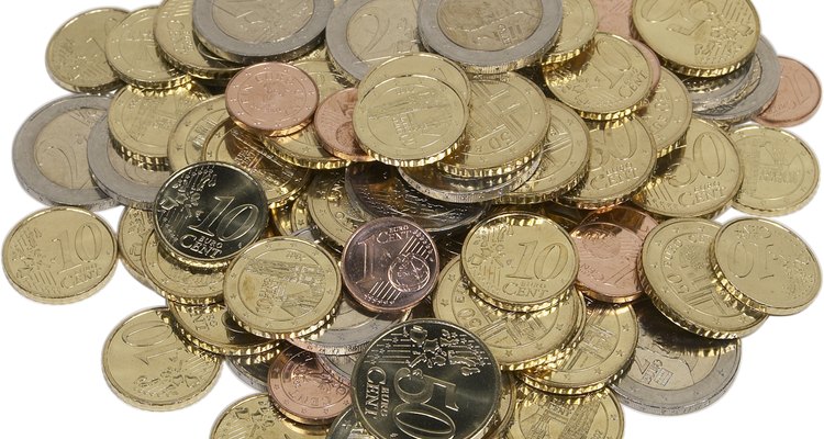 Use old coins such as pennies or tokens to create a keychain.