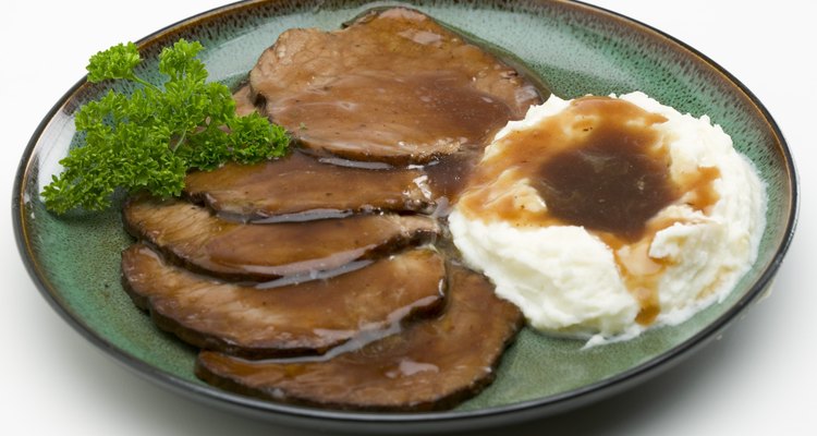 Serve braised chuck roast with mashed potatoes and gravy.