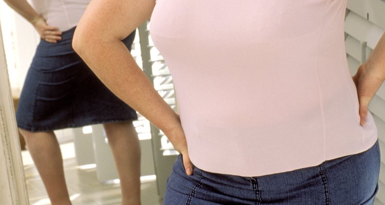 Woman looking at herself in the mirror