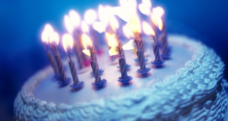 tungsten toned close-up of an array of candles on a birthday cake