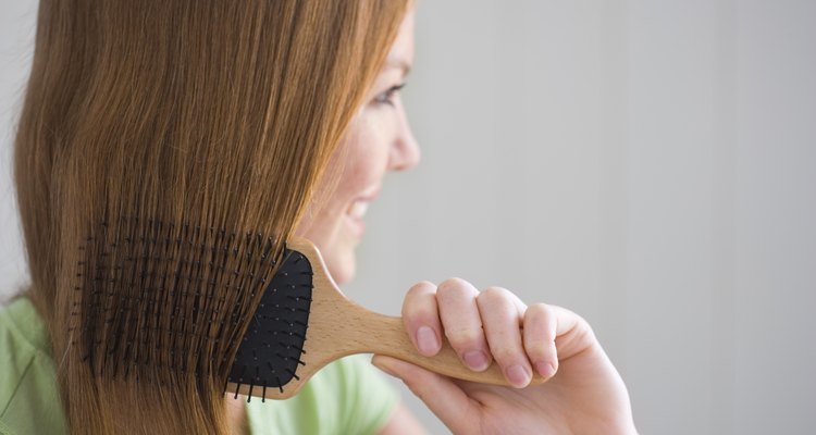 Woman combing her hair