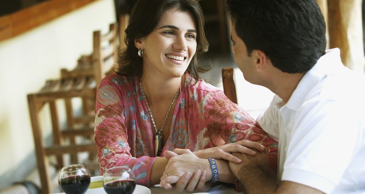 Couple drinking red wine in cafe