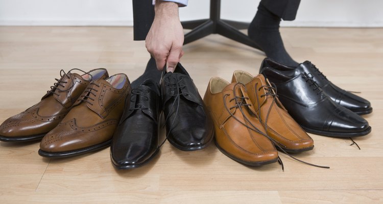 Man with variety of footwear