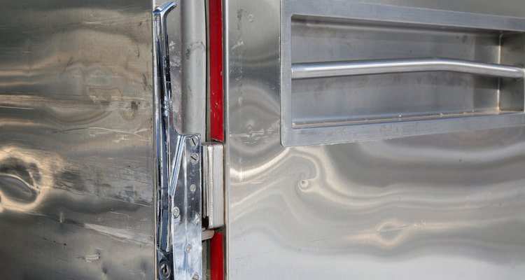 Moving a freezer on its side requires taking some precautions to prevent damage.