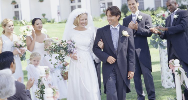 Bride and groom walking up aisle at wedding ceremony