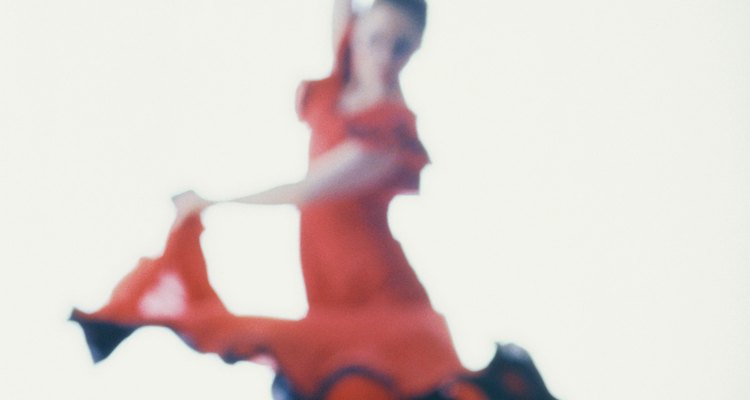 Flamenco dancers exhibit grace and physical control.