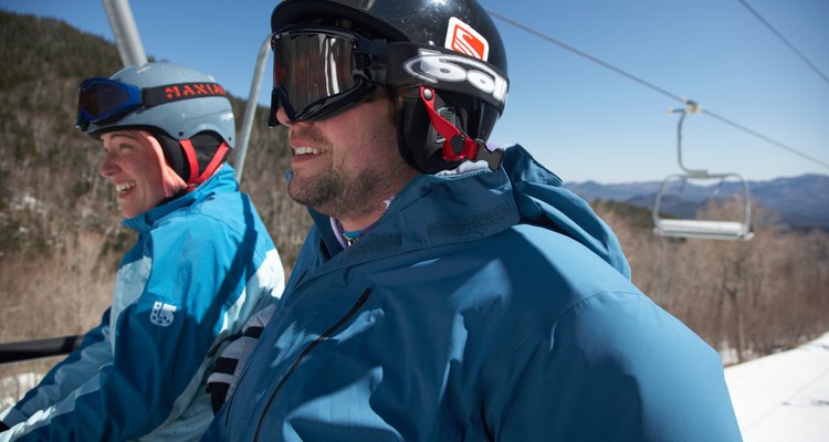 Young couple rioding ski lift