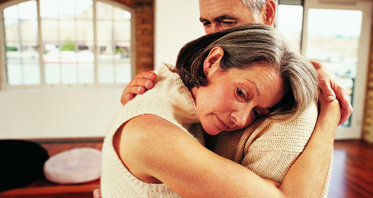 Mature Couple Embracing in Their Apartment