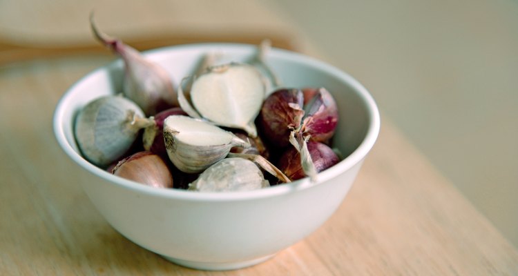 Onions and garlic bulbs on a plate