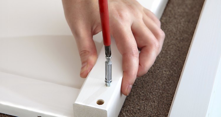 Unscrew the cam lock pin to get it out.