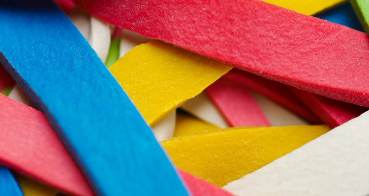 Teach the first law of thermodynamics using rubber bands and an infrared thermometer.