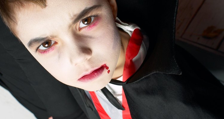 Homemade fangs add authenticity to a vampire costume.