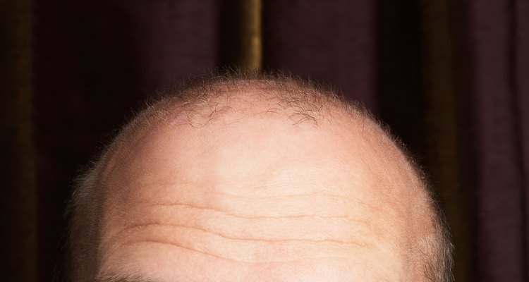 Cropped studio shot of balding man