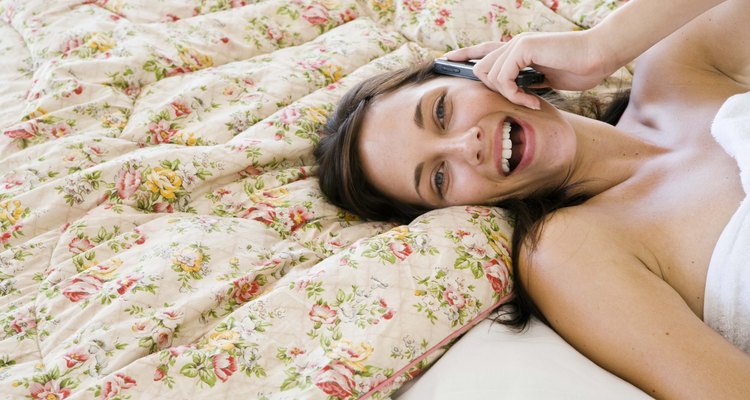 Woman smiling on cell phone