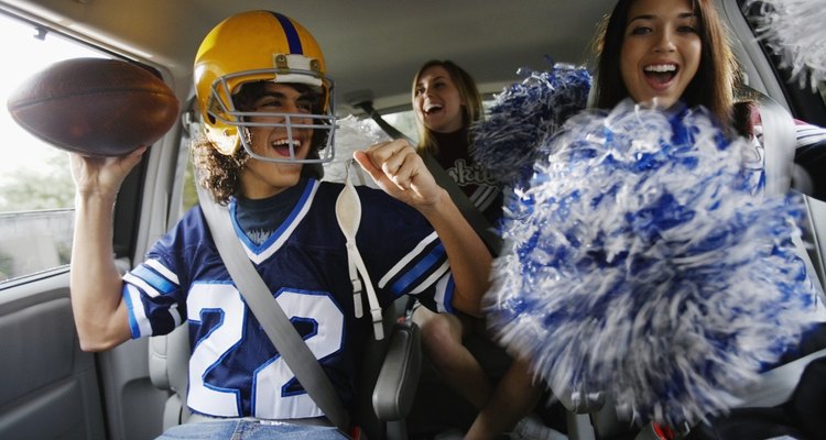 Football Player and Cheerleaders in Van