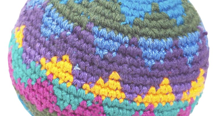 Knit a large ball to use up scraps; it makes a fun and functional pillow!